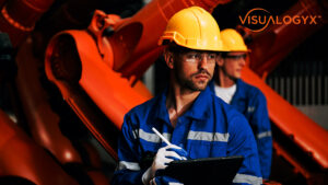 Worker inspecting plant product tablet
